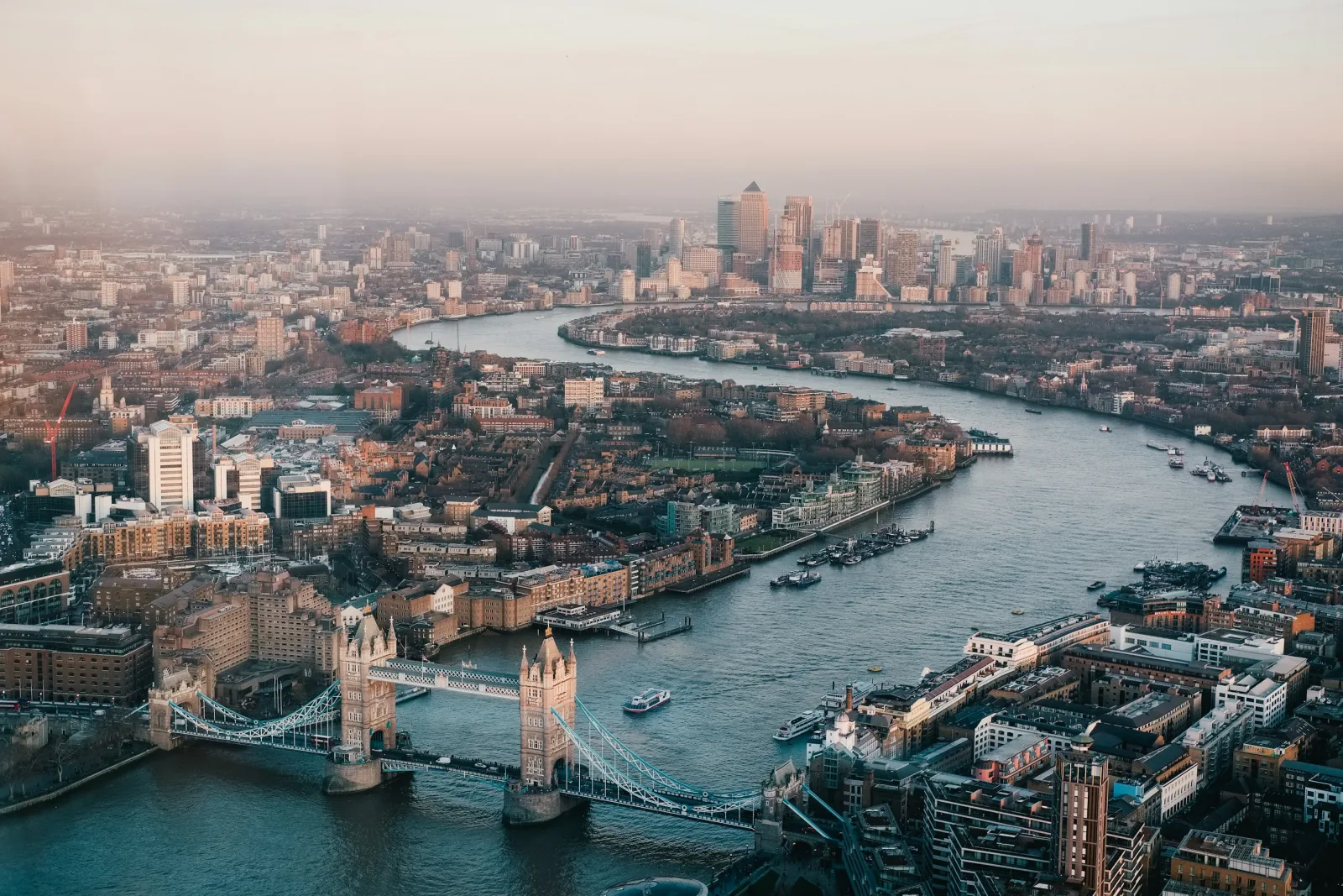 Aerial view of Tower Bridge, the River Thames and Canary Wharf in London.